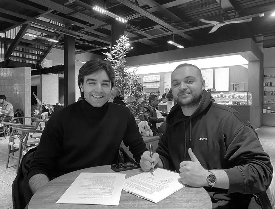 Two node101 team members at a café