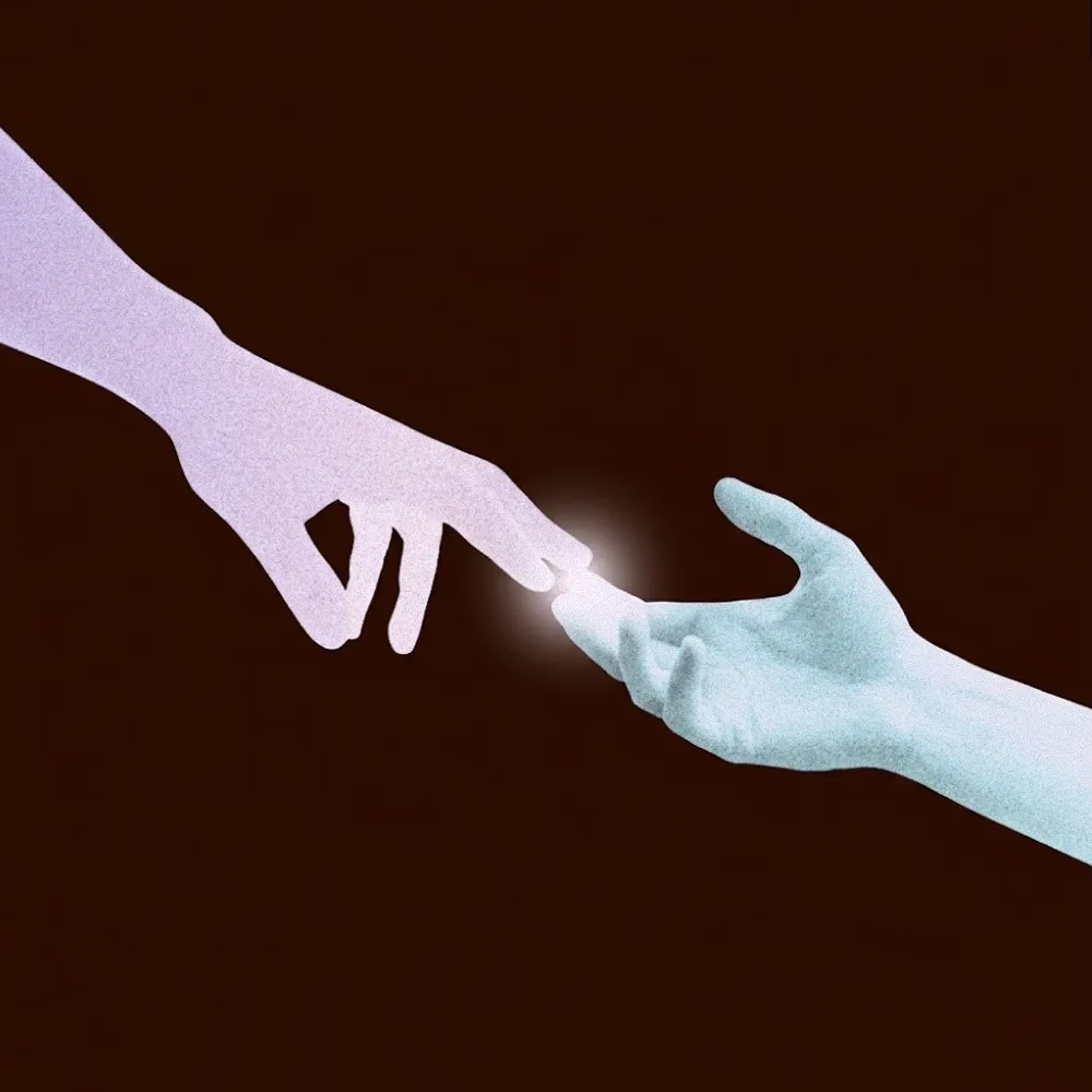 Two hands reaching toward each other